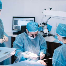 Dental team performing surgery to place dental implants