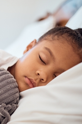 Child sleeping in bed