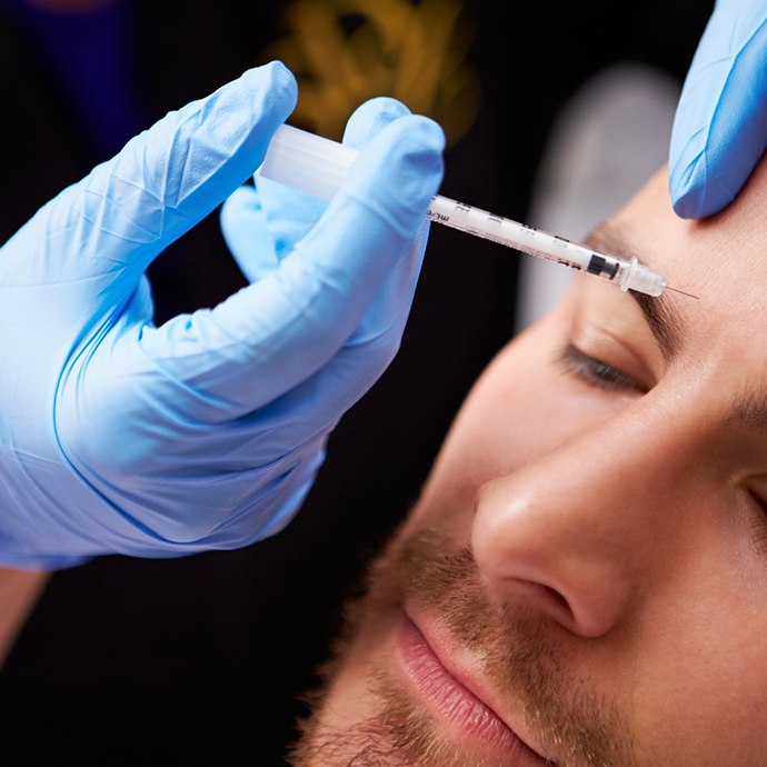 a man receiving a neurotoxin injection in his forehead