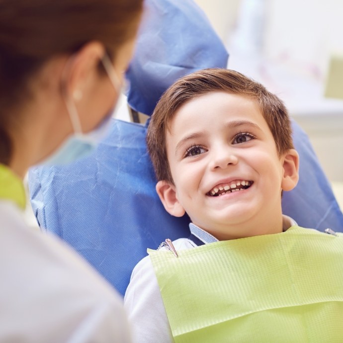 Child with dental sealants smiling