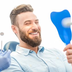 Man smiling while visiting Longmont cosmetic dentist