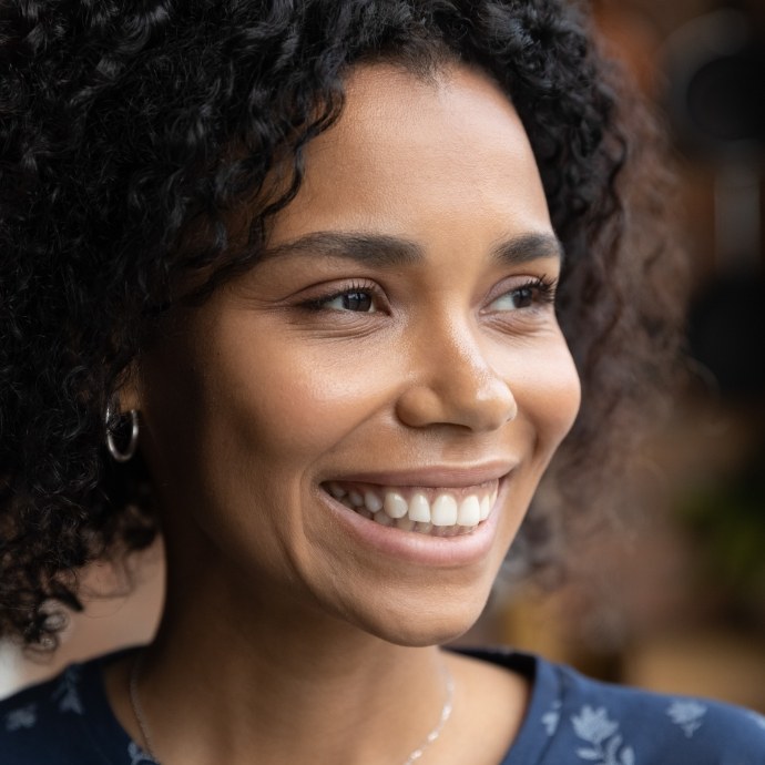 Woman with flawless smile after metal free dental restorations