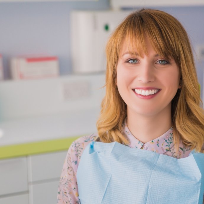 Woman receiving dental insurance covered dental care