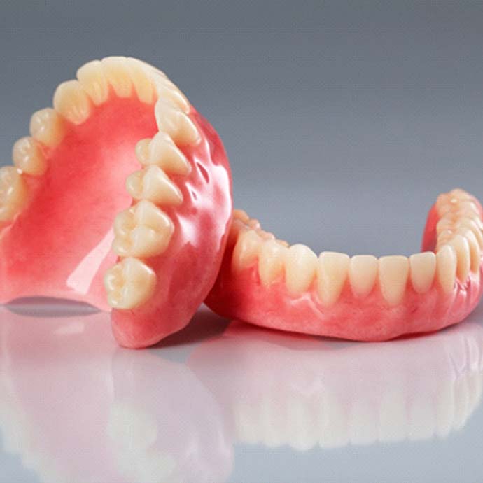 Series of dentures in Longmont resting on a table