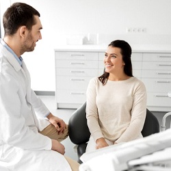 dentist explaining financing options to patient in Longmont