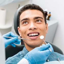 man getting dental checkup in Longmont