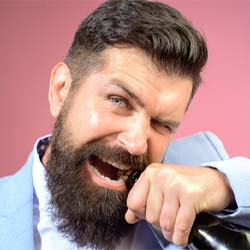 man opening bottle with teeth