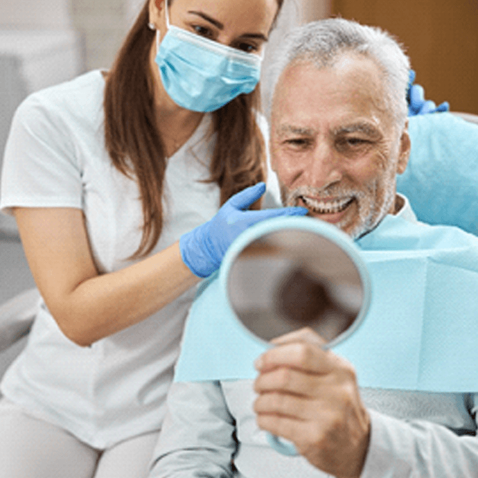 A man enjoying the benefits of dental implants in Longmont