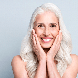 A woman happy about the benefits of dental implants in Longmont