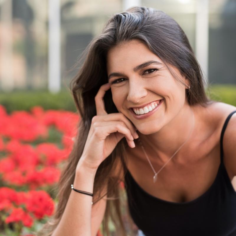 Woman with gorgeous smile outside