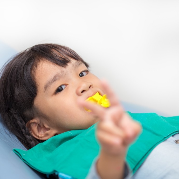 Child receiving fluoride treatment