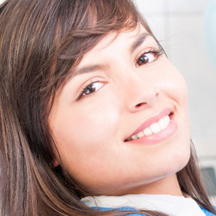ClClose-up of a female dental patient smiling