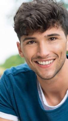 Man with healthy smile after restorative dentistry