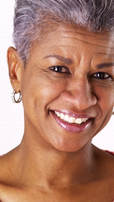 Woman smiling after sedation dentistry visit