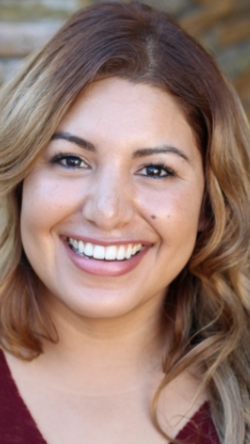 Woman smiling after emergency dentistry