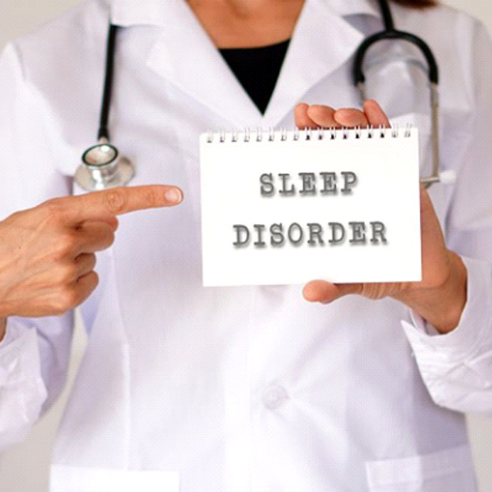 woman holding sign that states sleep disorder