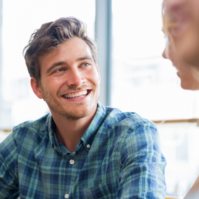 man smiling after getting veneers in Longmont