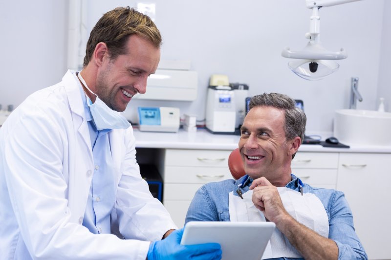 Picture of a patient talking to their dentist