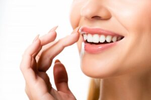 Close-up of person smiling with dental veneers.