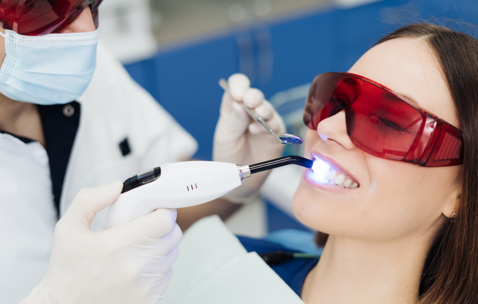 Woman undergoing professional dental whitening treatment